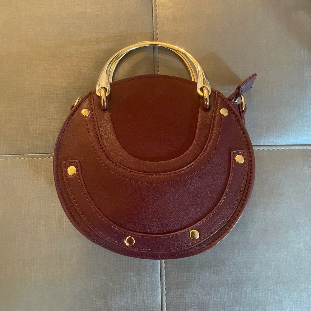 Burgundy mini round bag